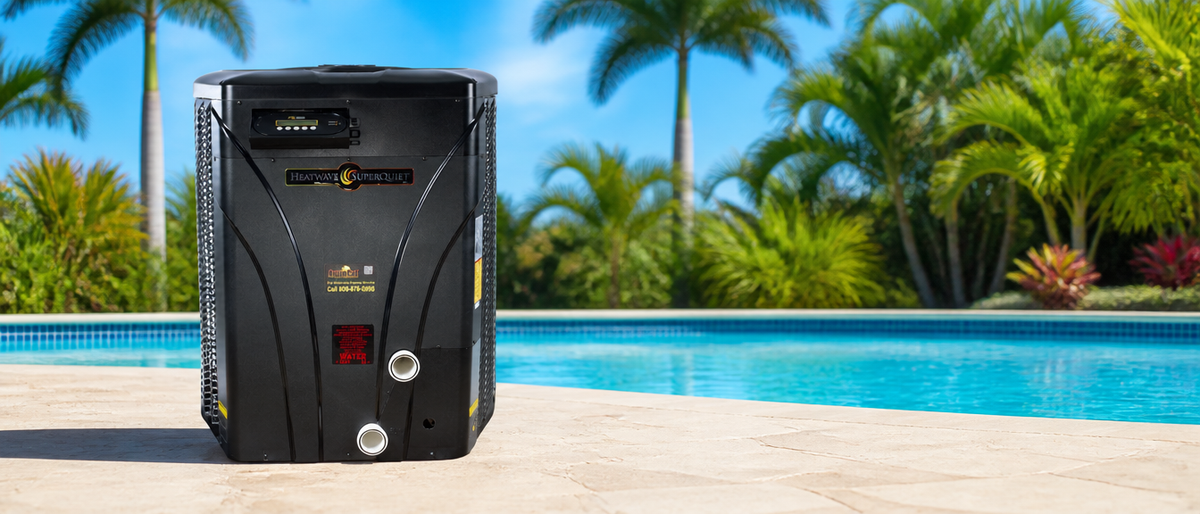 AquaCal HeatWave SuperQuiet heat pump beside a sunlit pool