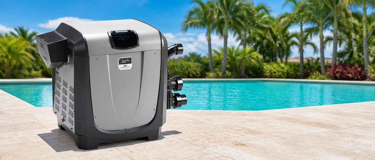 Jandy JXi pool and spa heater beside a sunlit pool